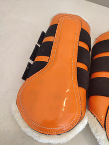 CLEARANCE PRICE! Orange brushing boots, stirrups